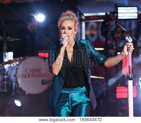 NEW YORK-DEC 31: Recording artist Carrie Underwood onstage during Dick Clark's New Year's Rockin' Eve at Times Square on December 31, 2015 in New York City.