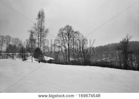 Snowy Meadow Near Valley Peklo In Machuv Kraj Region With Train On Railway Bridge On Background