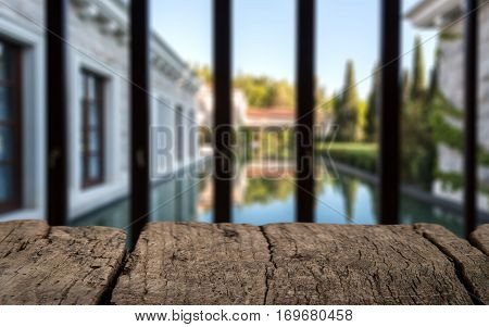 Wood Table Top On Blur Pool With Home Wall And Garden Background In Morning.for Montage Product Disp