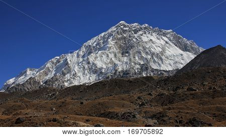 Scene on the way to the Everest base camp. Mount Nuptse high mountain of the Himalayas.