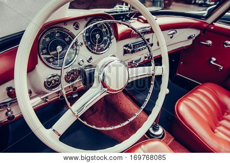 luxury car interior, leather steering wheel front seats and dashboard panel