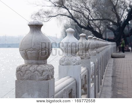 White Oriental Stone Fence Along The Promenade In Beihai Park, Central Beijing