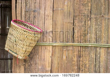 handmade basket hanging on bamboo wood panel show agriculture rural lofe of asian