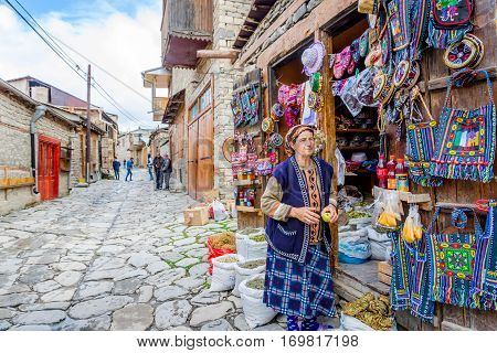 LAHICH AZERBAIJAN - OCTOBER 1: View over local street in Lahich people chatting and shop with bags souvenirs and herbs. October 2016