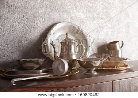 Set of dinnerware on gray background