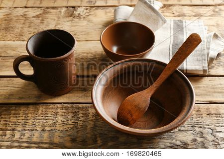 Set of dinnerware on wooden table