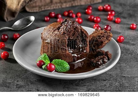 Chocolate fondant with berries on plate