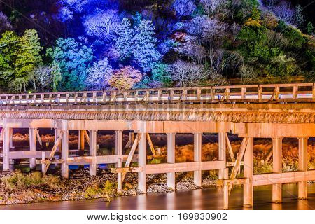 Arashiyama, Kyoto, Japan at Togetsukyo Bridge during the annual autumn light up.