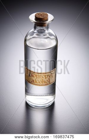 bottle of clear liquid labeled as isopropyl alcohol