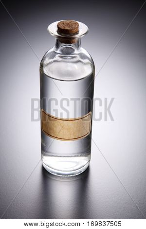 bottle of clear liquid unlabel