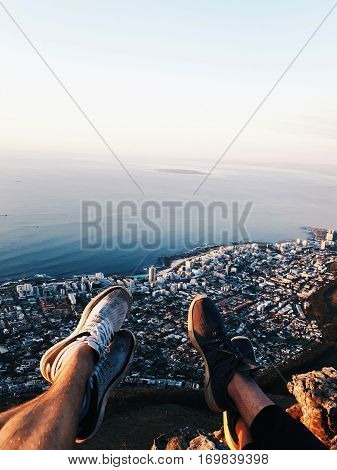 hiker on a top of a mountain lions head.