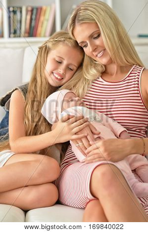 Portrait of a mom with two gaughters, close up