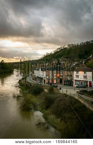 IRONBRIDGE UK - 14 FEBRUARY 2005: A view of the Shropshire town of Ironbridge on the banks of the River Severn on a grey and overcast evening.