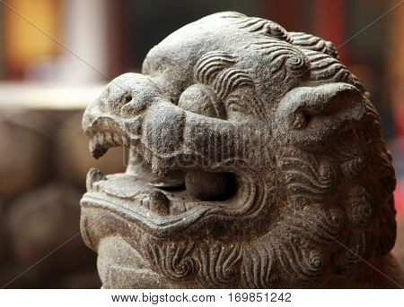 Traditional chinese stone lion in the temple