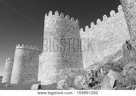 Avila (Castilla y Leon Spain): the famous medieval walls surrounding the city. Black and white