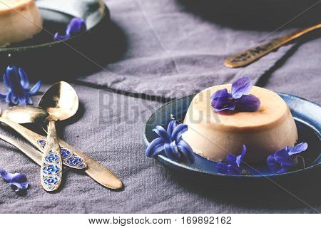 Caramel Pannacotta With Violet Flowers