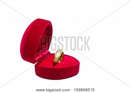 Wedding rings in a red box and card on white backgrounWedding rings in a red box on white backgroundd