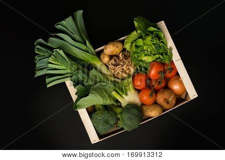 Assortment Of Fresh Vegetables In A Wooden Crate