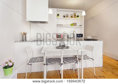 A Bright Kitchenette Module With Dining Table