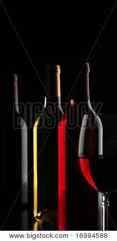 Bottles of wine on black background