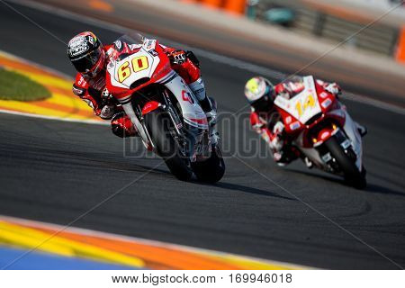 VALENCIA, SPAIN - NOV 12: 60 Simon, 14 Wilairot in Moto2 Qualifying during Motogp Grand Prix of the Comunidad Valencia on November 12, 2016 in Valencia, Spain.