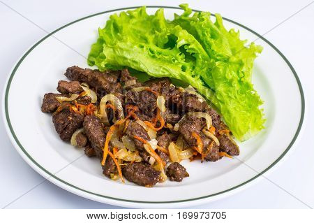 Calfs liver with letucce garnish. Studio Photo