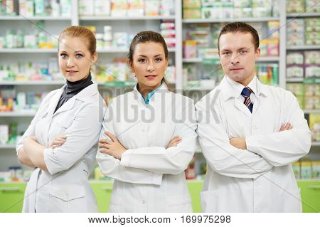 pharmaceutist woman and man workers in drug store