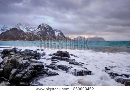 Rocky coast of fjord of Norwegian sea in winter. Vareid, Lofoten islands, Norway