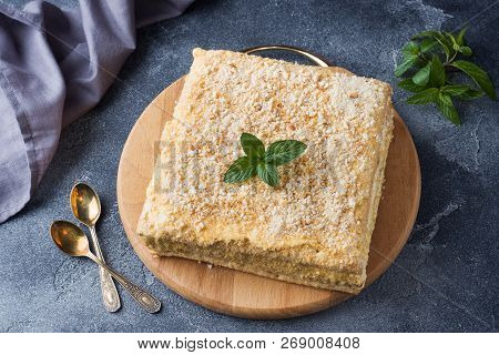 Layered Cake With Cream Napoleon Millefeuille Vanilla Slice With Mint On Dark Background.