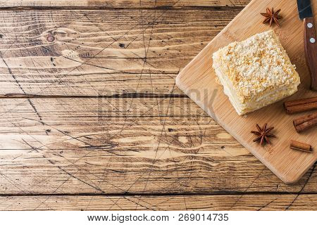 Layered Cake With Cream Napoleon Millefeuille Vanilla Slice With Cinnamon And Anise On Wooden Backgr
