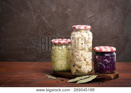 Sauerkraut In A Blue Bowl On A Wooden Table