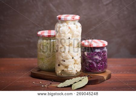 Sauerkraut In A Blue Bowl On A Wooden Table
