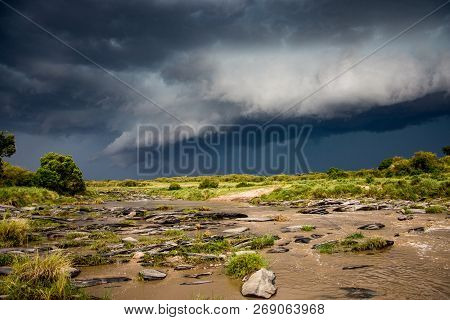 Thunderstorm Moving Over A Savannah In Maasai Mara Game Reserve, Kenya.