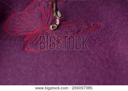 Making Of Embroidery Of Pink Butterfly On Purple Boiled Wool With An Embroidery Machine - View On Ob