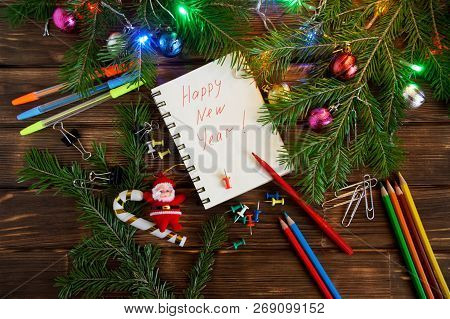 New Year In The Office. Notepad With Congratulations. Happy New Year And Merry Christmas! 2019.