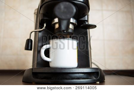 Photo Of Coffee Maker, Mug On Table In Kitchen
