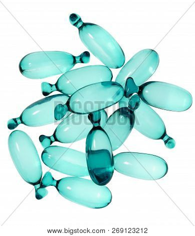 Blue Translucent Cosmetic Capsules On White Background With Clipping Path