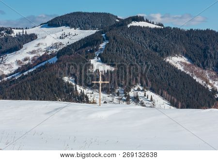 Morning Winter Snow Covered Picturesque Mountain Ridge And Religious Cross On Hill Top(ukraine, Carp