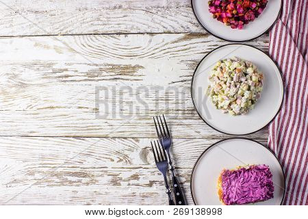 Assortment Salad Of Russian Cuisine - Olivier Salad, Vinaigrette - Beet Salad, Herring Salad.