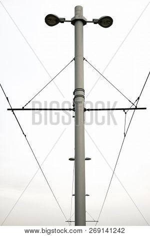 Detail of a catenary and stormy sky.