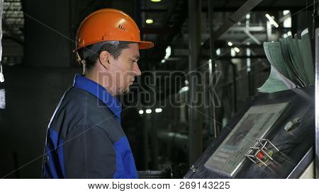 Operator Monitors Control Panel Of Production Line. Manufacture Of Plastic Water Pipes Factory. Proc