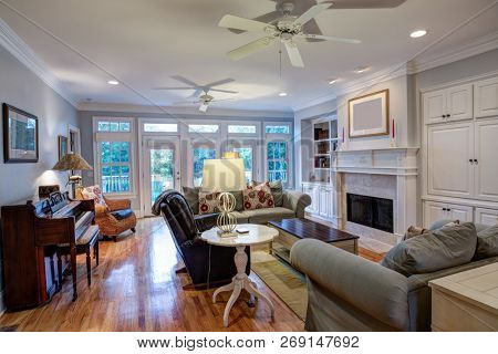 Beautiful living room with fireplace and lots of windows
