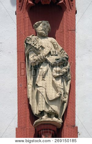 WURZBURG, GERMANY - JULY, O4,2018: Saint Peter the Apostle statue on the portal of the Marienkapelle in Wurzburg, Bavaria, Germany