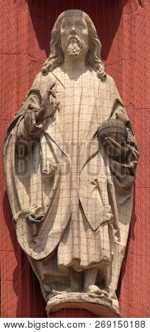 WURZBURG, GERMANY - JULY, O4,2018: Christ the Saviour statue on the portal of the Marienkapelle in Wurzburg, Bavaria, Germany