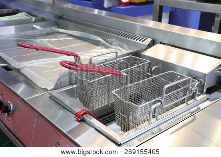 New Empty Modern Professional Fryer Basket In Kitchen Restaurant ; Food Industy