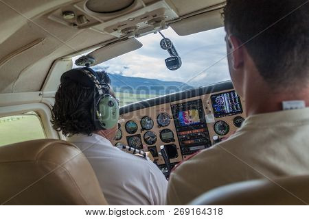 Canaima, Venezuela - August 16, 2015: Pilot Of A Small Cessna 210 Centurion Airplane Heading To Cana