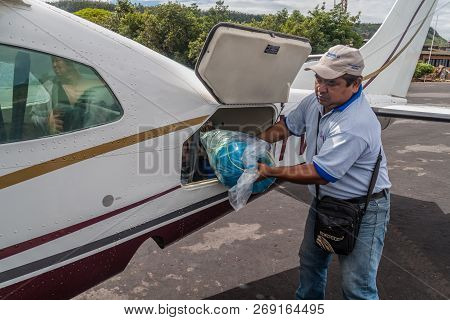 Canaima, Venezuela - August 16, 2015: Unloading Of Cessna 210 Centurion Airplane At The Airport In C