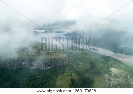 Aerial View Of River Caroni And One Of The Tepuis Table Mountains In Venezuela