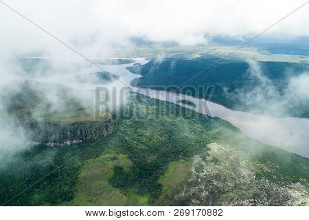 Aerial View Of River Caroni And One Of The Tepuis Table Mountains In Venezuela