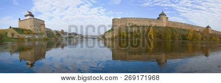 Panorama Of The Border River Narva In The Golden Autumn. Border Of Estonia And Russia